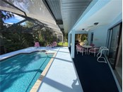 Covered area by the pool. - Single Family Home for sale at 18506 Hottelet Cir, Port Charlotte, FL 33948 - MLS Number is C7452138