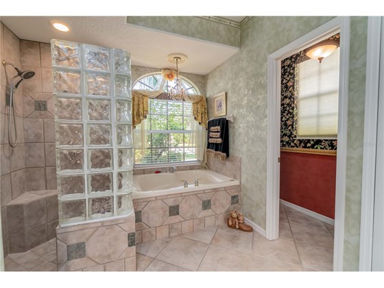 Bathroom retreat with Walk-in Curbless shower, pre-wired Jacuzzi Garden Tub and Private Water Closet. - Single Family Home for sale at 6521 Sundew Ct, Lakewood Ranch, FL 34202 - MLS Number is A4514104