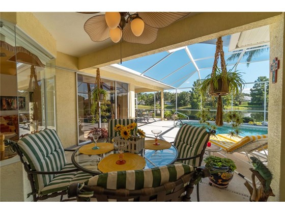Enjoying your favorite drink at the second outdoor undercover ceiling fan area. - Single Family Home for sale at 6521 Sundew Ct, Lakewood Ranch, FL 34202 - MLS Number is A4514104