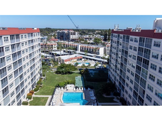 Aerial view of the central courtyard looking to the NE - Condo for sale at 244 Saint Augustine Ave #104, Venice, FL 34285 - MLS Number is A4518081