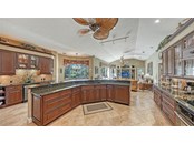 Oversized island with breakfast bar. - Single Family Home for sale at 8821 Misty Creek Dr, Sarasota, FL 34241 - MLS Number is A4521942