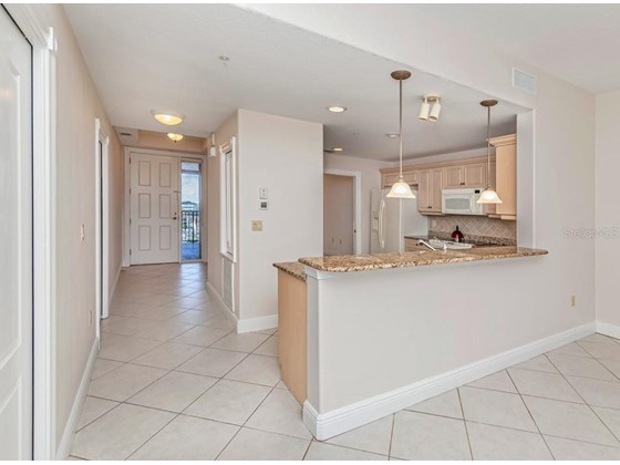 Kitchen, foyer - Condo for sale at 147 Tampa Ave E #702, Venice, FL 34285 - MLS Number is N6116949