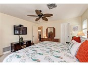 generous size guest bedroom with walk in closet - Single Family Home for sale at 10 Pine Ridge Way, Englewood, FL 34223 - MLS Number is N6118641